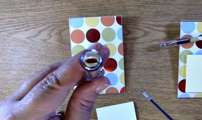 Place ink inside of the pen where the decorative paper tube hole is